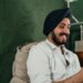Happy Indian man with smartphone | IBOMMA TV